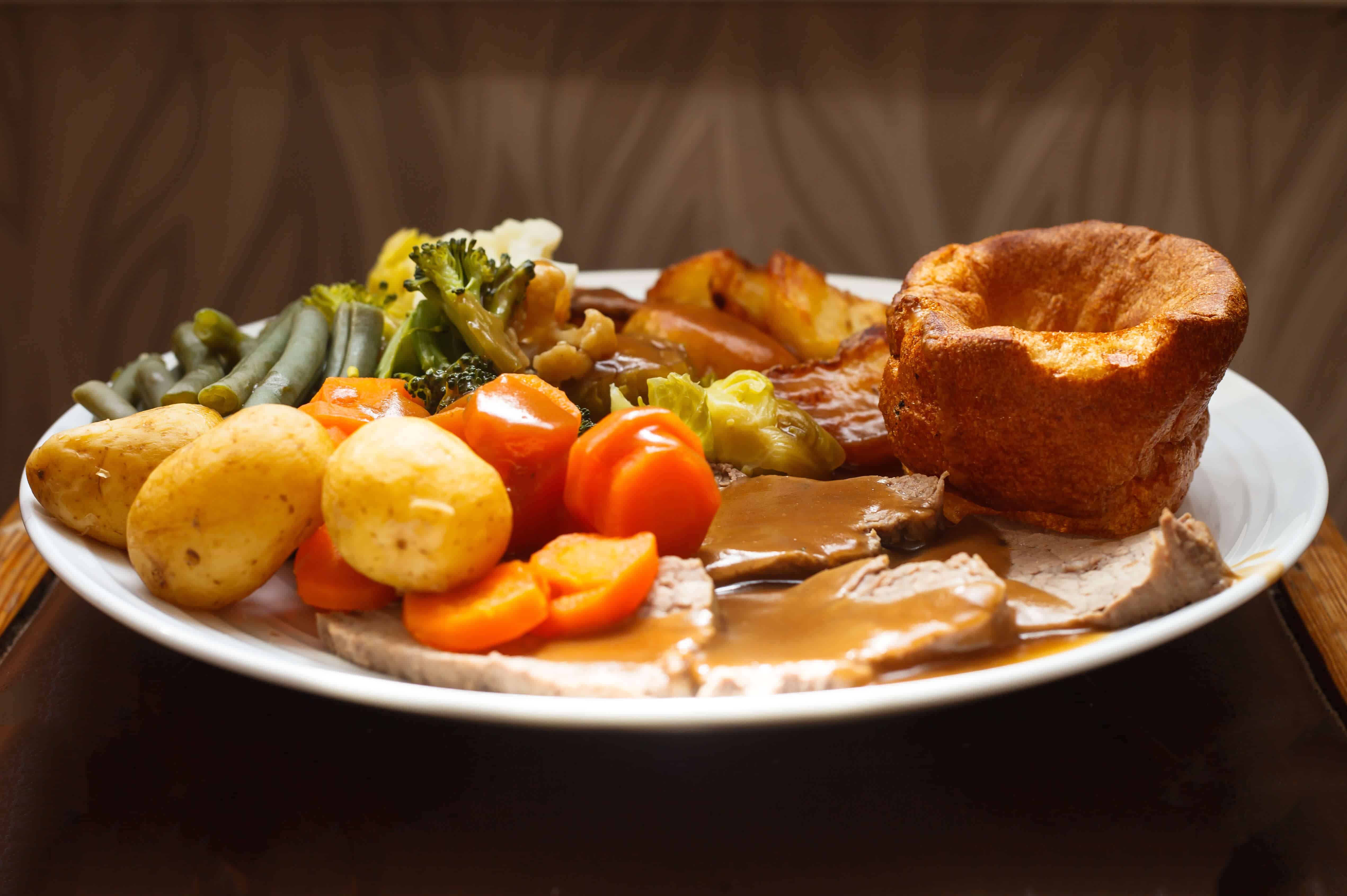 Traditional British roast beef and Yorkshire pudding dinner