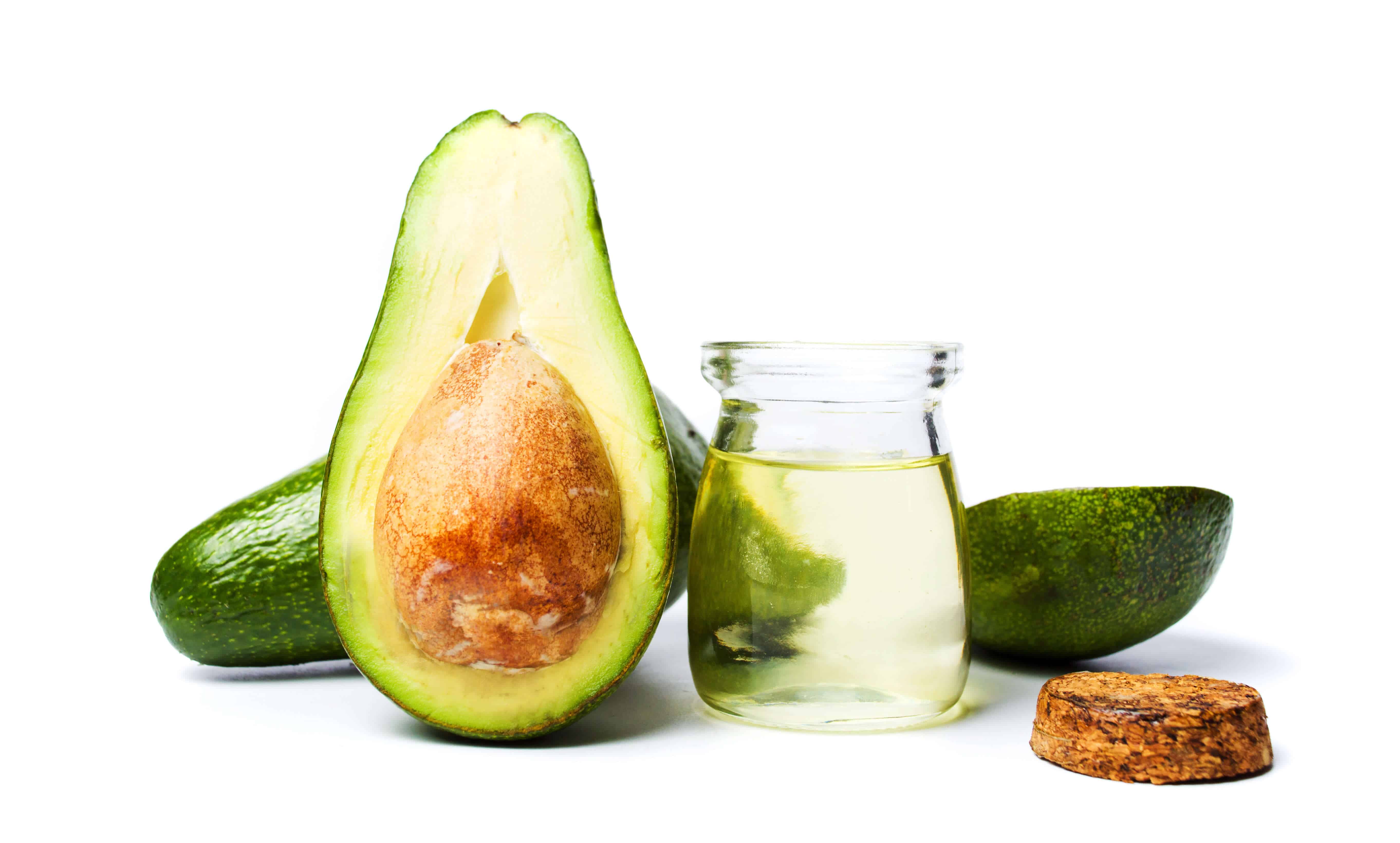 Avocado fruit and oil on white background