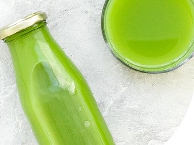 an algae drink in a glass bottle
