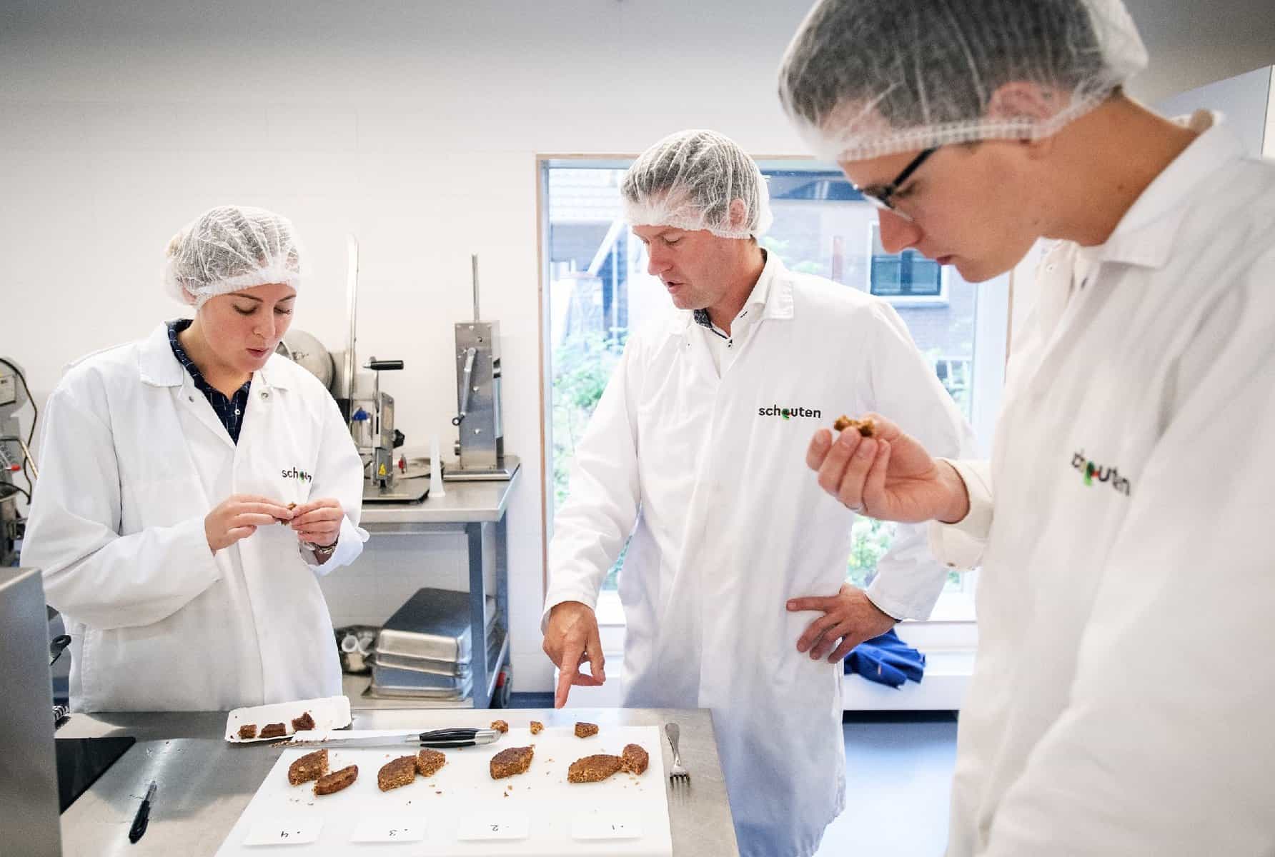 Three Schouten developers tasting vegetable nuggets