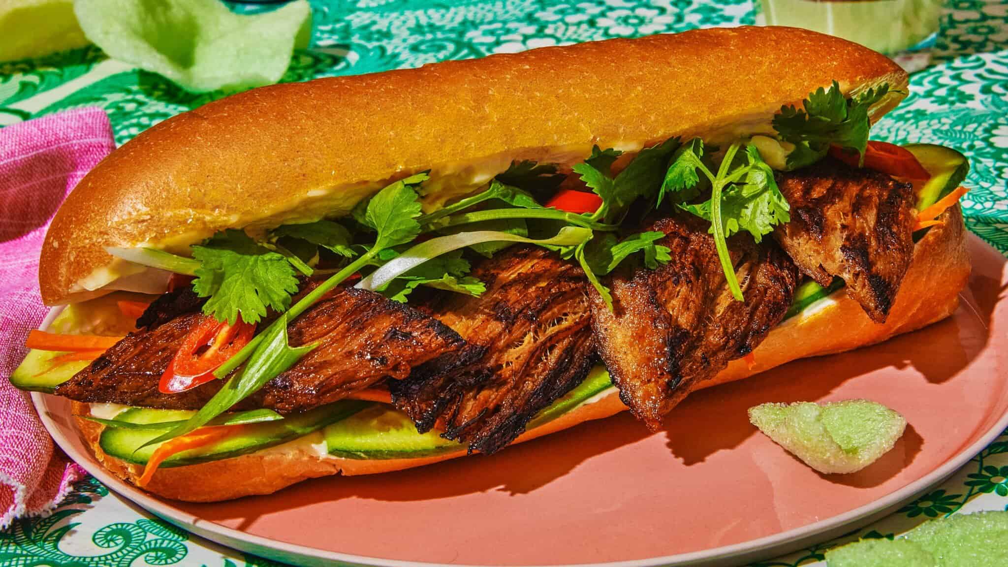 A plant-based tender pork sandwich on a plate
