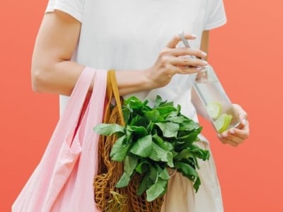 Woman with healthy food shopping spinach Tastewise
