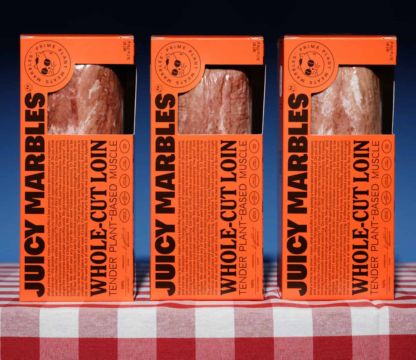 Juicy Marbles packages of it plant-based whole cut loin on top of a table