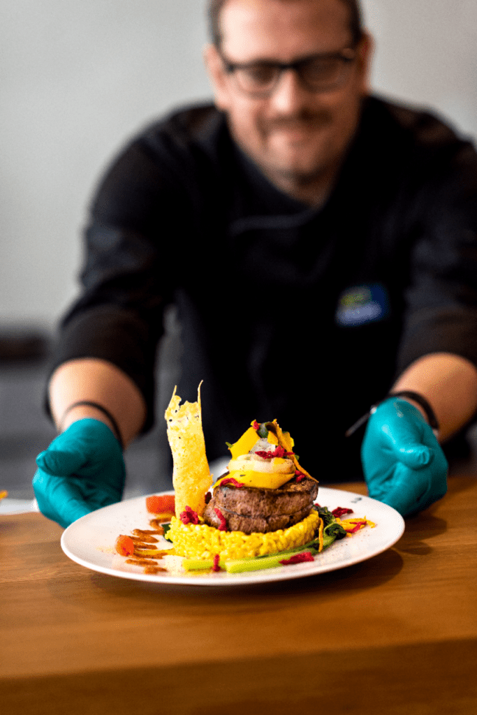 ADM chef presenting a beautiful dish