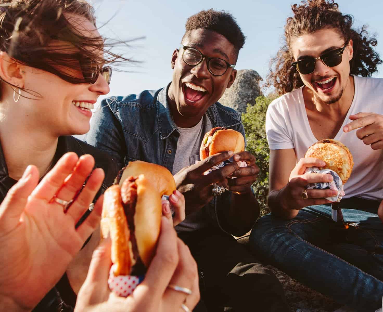 People eating plant-based burgers by PlantPlus Foods
